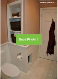 litter box built into the bathroom wall