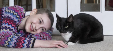 black and white cat with her human